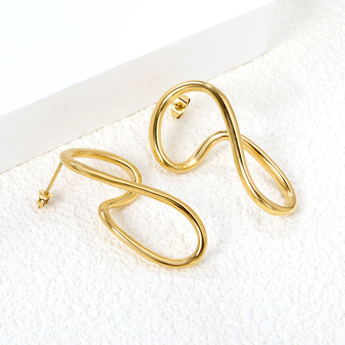 Boucles d'oreilles créoles courbées chics