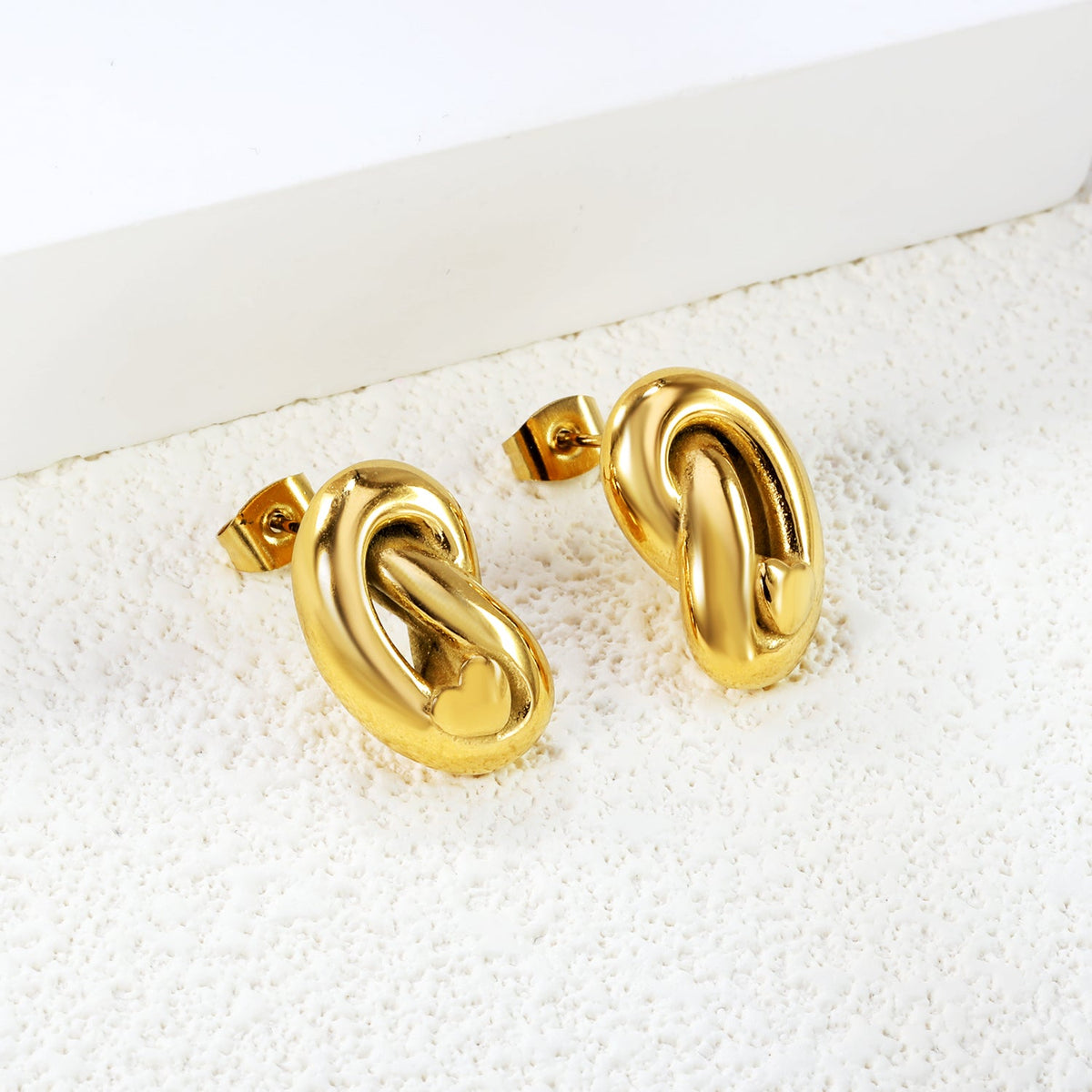 Boucles d'oreilles nœud Knot & Shine