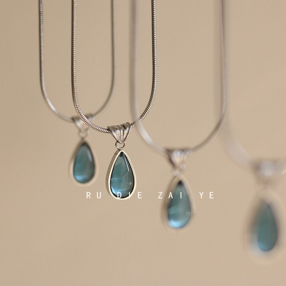 Collier pendentif goutte d'eau rétro français en acier titane
