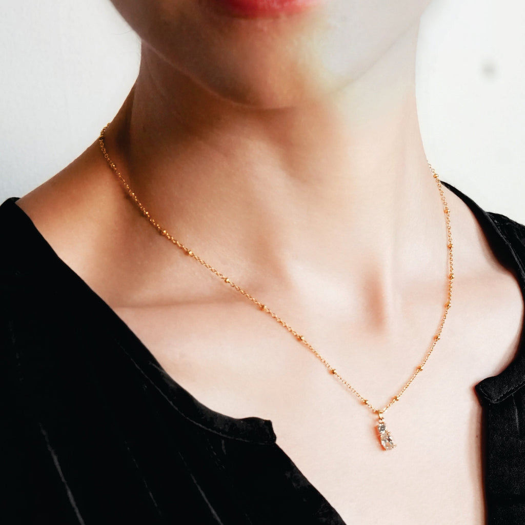 CABBANA Or : collier chaîne perlée avec duo de pendentifs en zircon