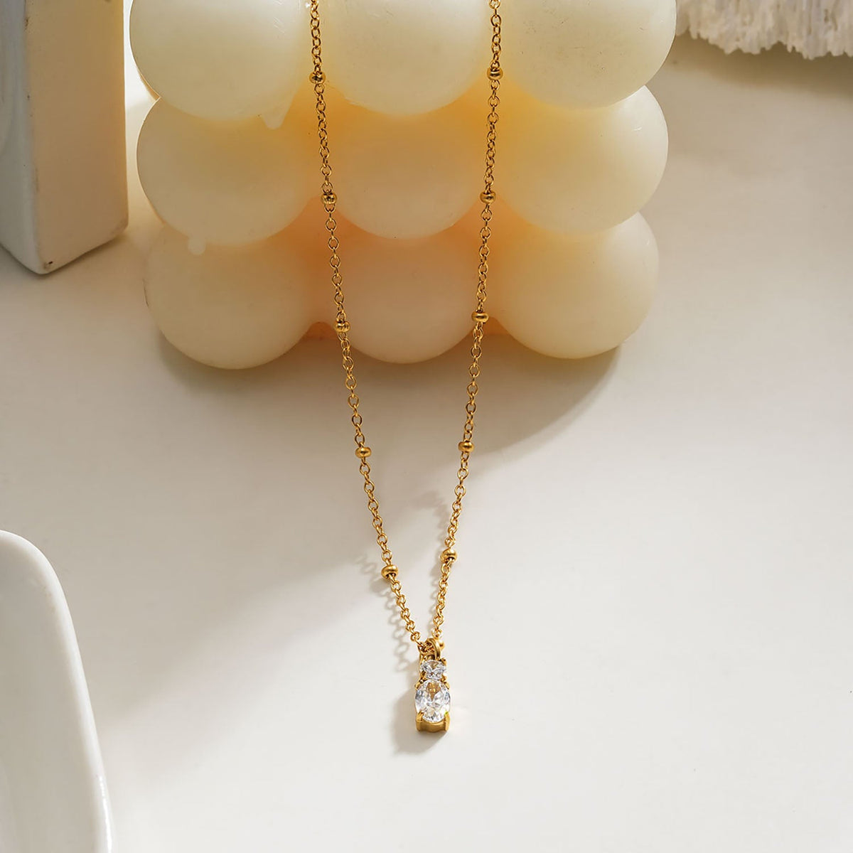 CABBANA Or : collier chaîne perlée avec duo de pendentifs en zircon