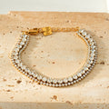 NANDAMA Or : bracelet tennis triple rang en zircons (CZ) avec pièce centrale audacieuse