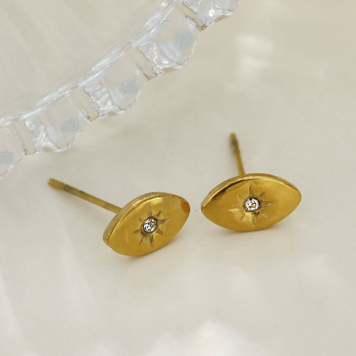 TINDRA: Oval Shaped Gold Stud Earrings Featuring a Solitaire Zirconia