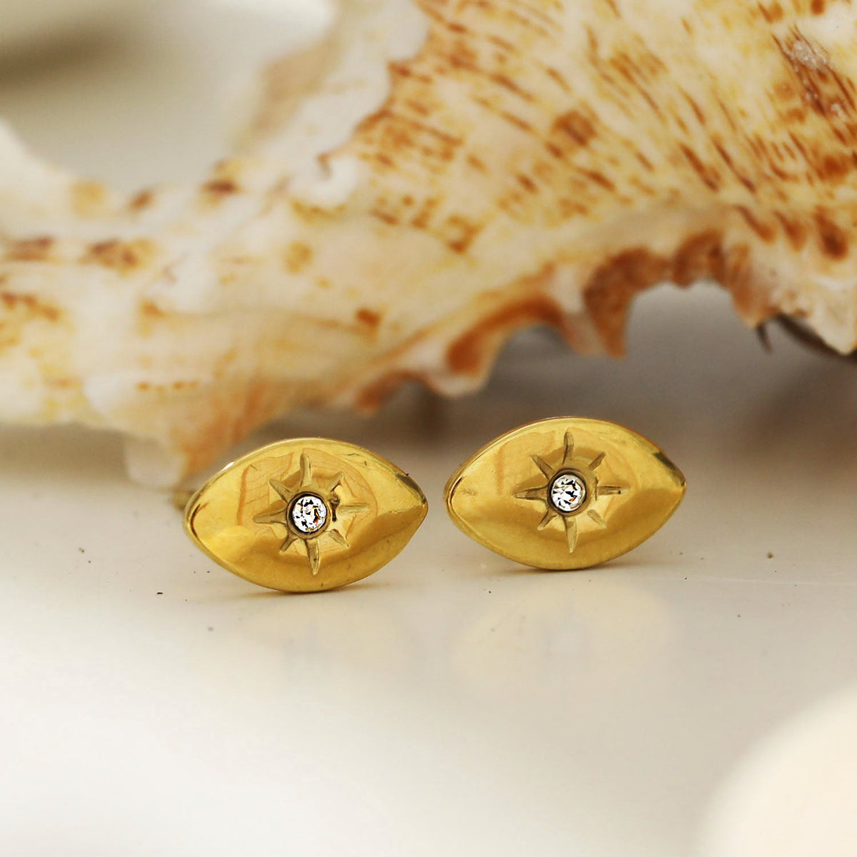 TINDRA: Oval Shaped Gold Stud Earrings Featuring a Solitaire Zirconia