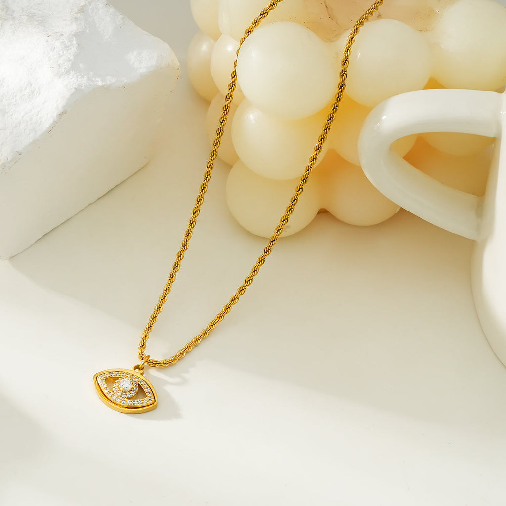PROTACTOR Or : collier chaîne avec œil protecteur serti de zircons (CZ)