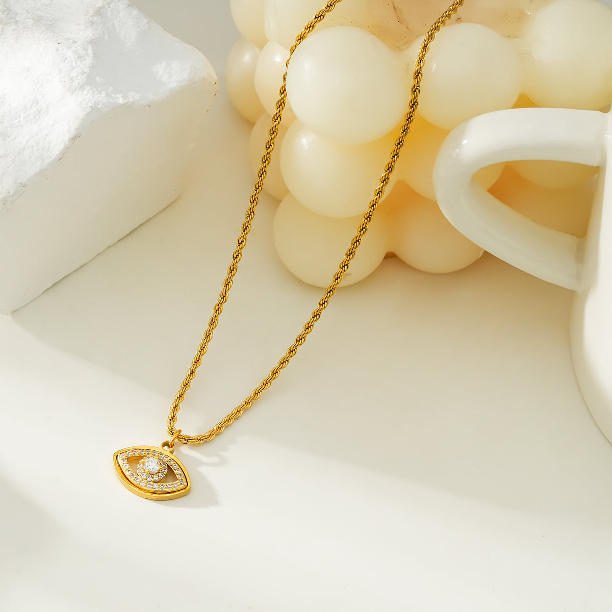 PROTACTOR Or : collier chaîne avec œil protecteur serti de zircons (CZ)