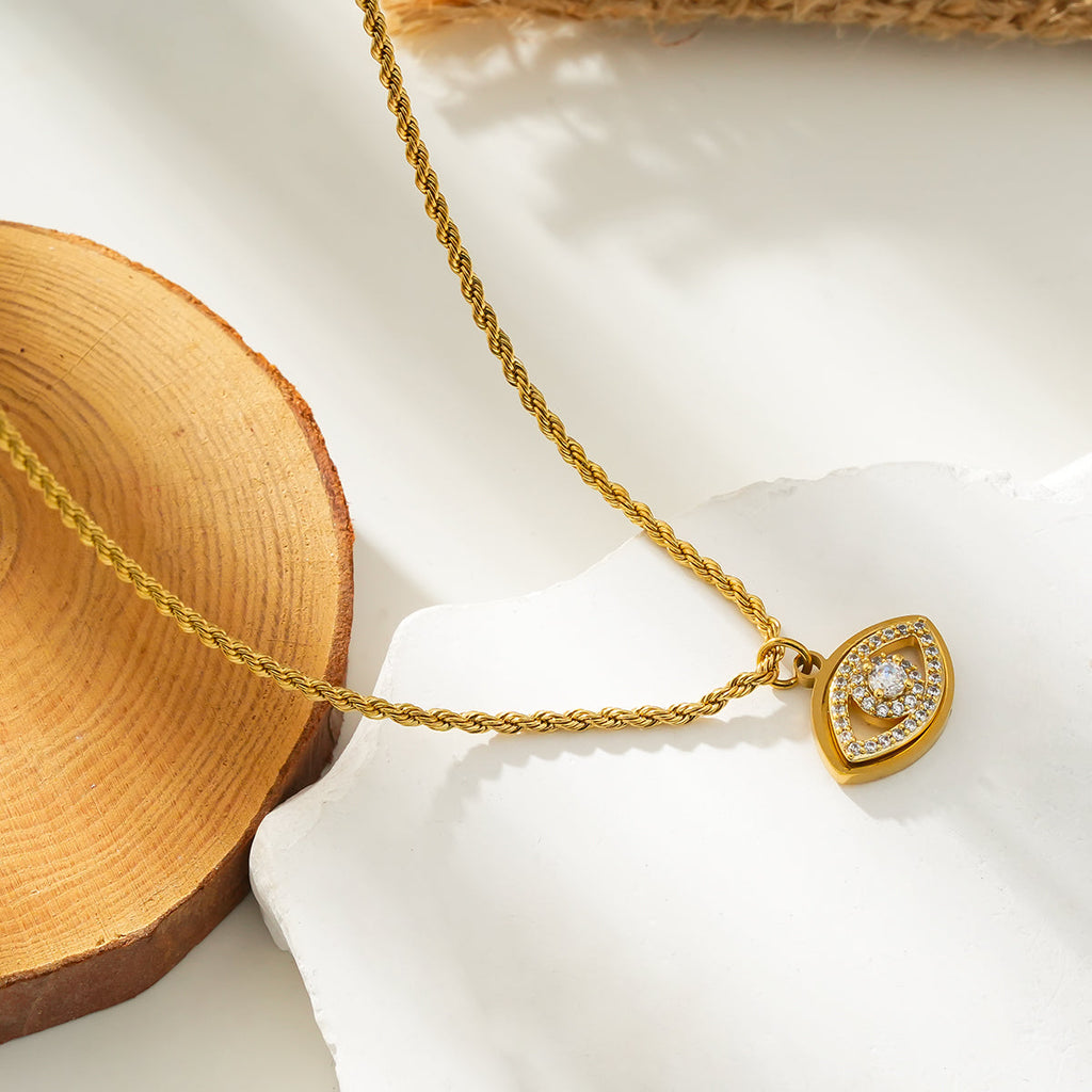 PROTACTOR Or : collier chaîne avec œil protecteur serti de zircons (CZ)