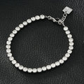 RITMO Or blanc (ton argent) : bracelet tennis classique, élégance intemporelle